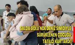 Salda Gölü'nde deniz simidiyle sürüklenen çocuğu tatilci kurtardı!