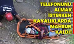 Telefonunu almak isterken kayalıklarda mahsur kaldı!