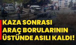 Kaza sonrası araç borularının üstünde asılı kaldı!