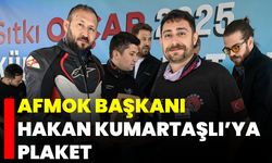 AFMOK Başkanı Hakan Kumartaşlı’ya Plaket