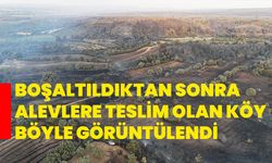 Boşaltıldıktan sonra alevlere teslim olan köy böyle görüntülendi