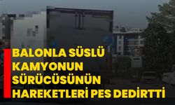 Balonla süslü kamyonun sürücüsünün hareketleri pes dedirtti