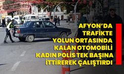 Afyon’da trafikte yolun ortasında kalan otomobili kadın polis tek başına ittirerek çalıştırdı