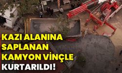 Kazı alanına saplanan kamyon vinçle kurtarıldı!