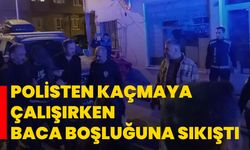 Polisten kaçmaya çalışırken baca boşluğuna sıkıştı