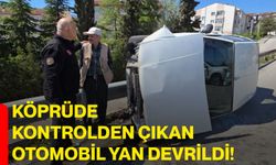 Köprüde kontrolden çıkan otomobil yan devrildi!