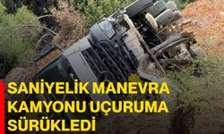 Saniyelik manevra kamyonu uçuruma sürükledi