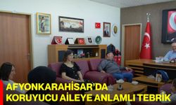 Afyonkarahisar’da Koruyucu Aileye Anlamlı Tebrik