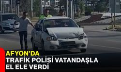 Afyon’da trafik polisi vatandaşla el ele verdi
