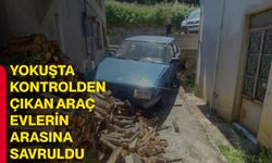 Yokuşta kontrolden çıkan araç evlerin arasına savruldu