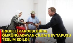 Engelli kardeşlerine ömrünü adayan Çilem'e ev tapusu teslim edildi