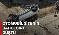 Otomobil sitenin bahçesine düştü