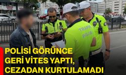 Polisi görünce geri vites yaptı, cezadan kurtulamadı