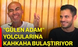 "Gülen Adam" yolcularına kahkaha bulaştırıyor