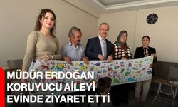 Müdür Erdoğan, koruyucu aileyi evinde ziyaret etti