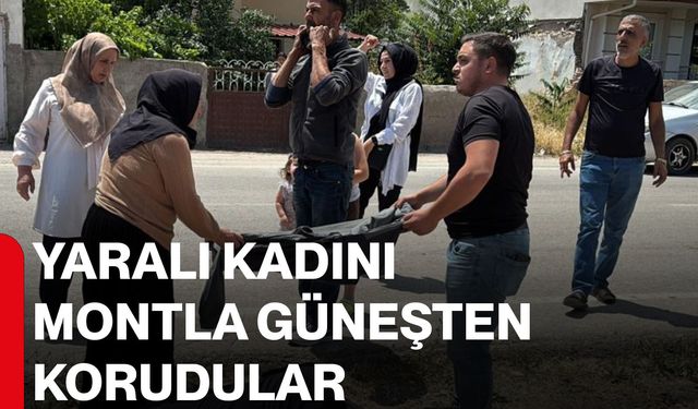 Yaralı kadını montla güneşten korudular