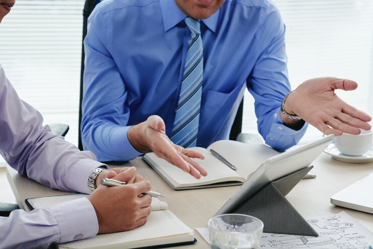 Cropped Men Discussing Annual Report Using Digital Tablet 1098 19135
