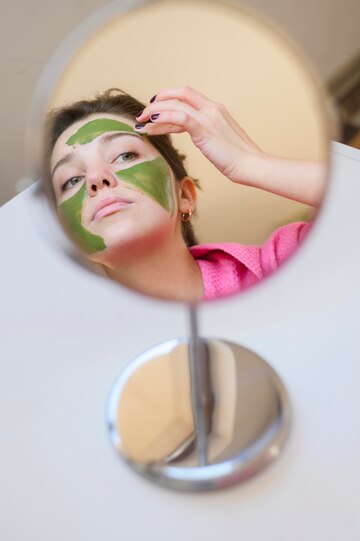 Woman Applying Face Mask Mirror 23 2148520325